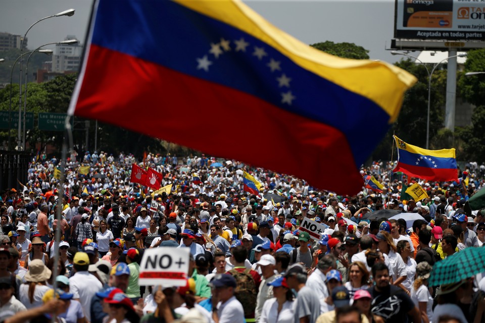 Demonstrators march during an opposition rally in Caracas