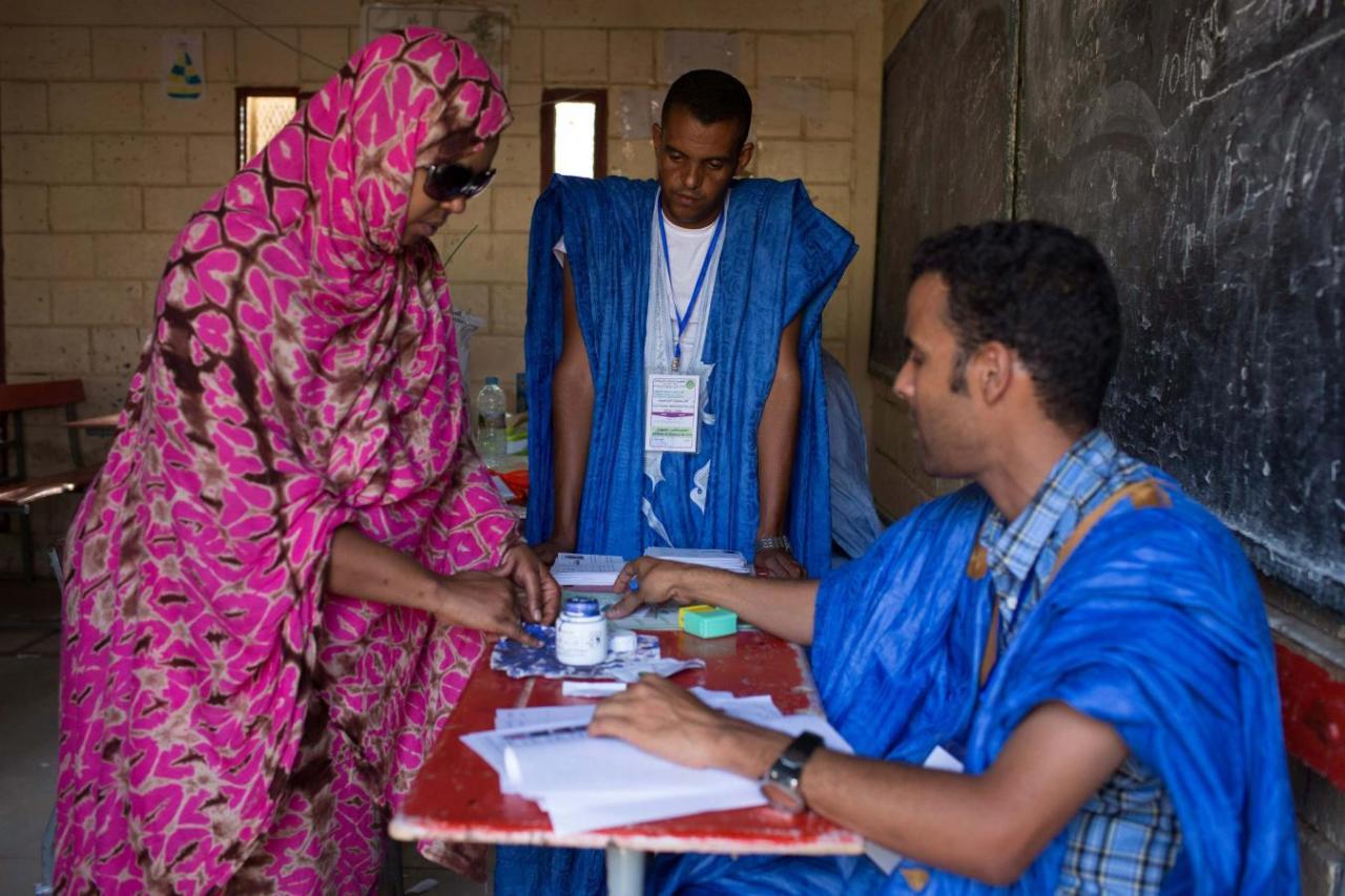 A woman has her finger dipped in ink after voting during the presidential elections in Nouakchott