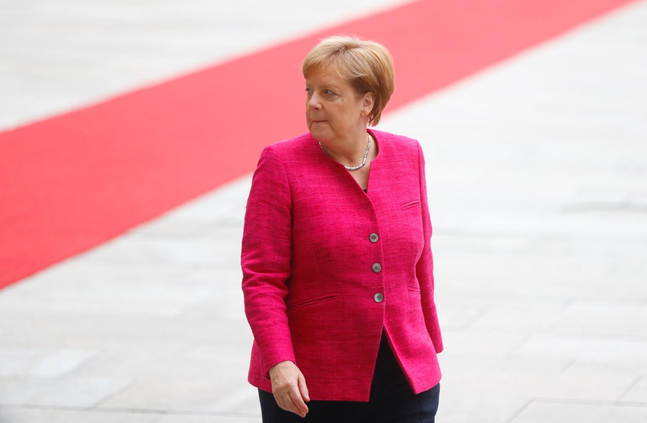 German Chancellor Angela Merkel looks on as she welcomes Spanish Prime Minister Pedro Sanchez at the chancellery in Berlin