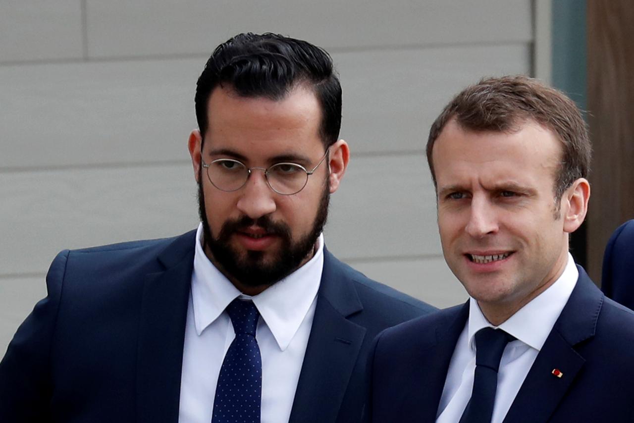 FILE PHOTO: French President Emmanuel Macron and Elysee senior security officer Alexandre Benalla arrive at an elementary school to attend a one-hour interview with French news channel TF1, in Berd’huis